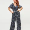 Dolly & Dotty Black Dinosaur & Rainbow Print Charlotte Jumpsuit